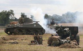 armoured vehicles in a mock battle